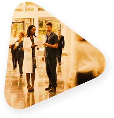 Triangle Shows Two Healthcare Workings Talking In A - Health Care (385x391), Png Download