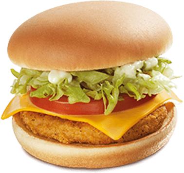 A Breaded Chicken Patty Garnished With Freshly Cut - Cheeseburger (700x474), Png Download