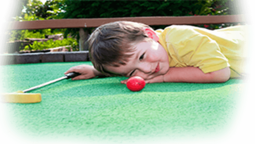 Young Boy Eyeballing The Ball Shot At Miniature Golf - Miniature Golf (825x466), Png Download