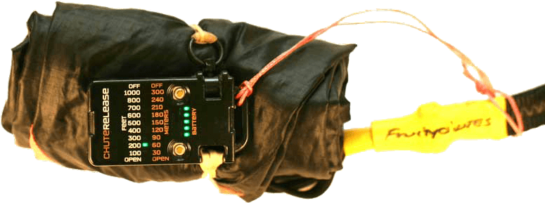 Chute Release Holds A Rolled Up Parachute - Jolly Logic Chute Release (800x450), Png Download